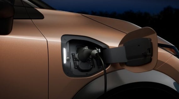 Close-up image of charging cable plugged in | Dutch Miller Nissan in Bristol TN