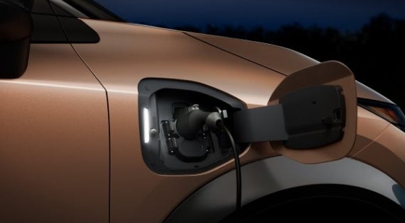 Close-up image of charging cable plugged in | Dutch Miller Nissan Of Bristol in Bristol TN