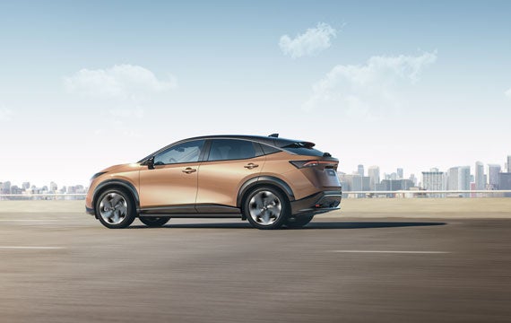 Nissan ARIYA side view on broad highway | Dutch Miller Nissan Of Bristol in Bristol TN