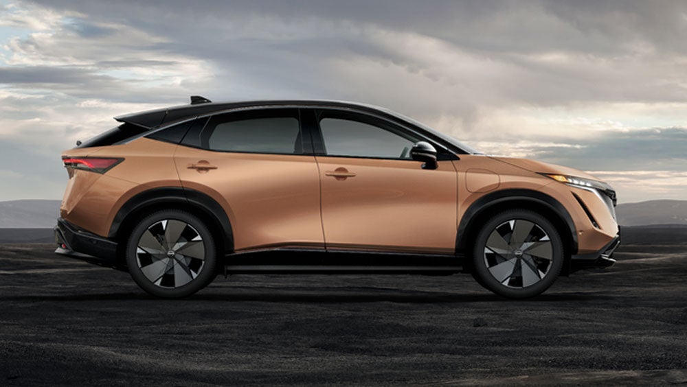 Nissan ARIYA in Sunrise Copper in dramatic landscape | Dutch Miller Nissan Of Bristol in Bristol TN
