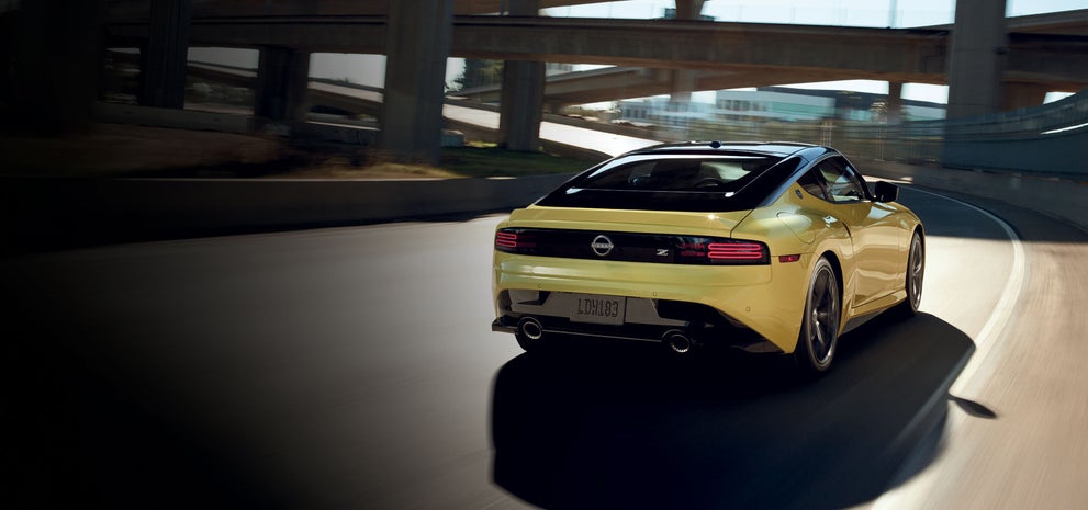 2024 Nissan Z in yellow driving on a highway